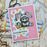 Bright Easter-egg card with the grumpy bunny-eared cat, captioned 'This is my egg-cited face.'