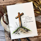 White card with wooden cross on a wildflower hill — because He lives I can face tomorrow