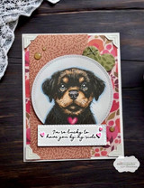 Pink floral card with Sandy in a stitched circle over patterned paper, finished with a small sentiment strip reading I'm so lucky to have you by my side.