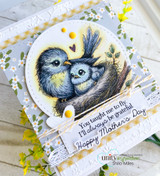 Handmade Mother's Day card of a blue mama bird nestling her chick in a die-cut circle on floral paper, stamped 'You taught me to fly, I'll always be grateful' and 'Happy Mother's Day.'