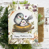 Mother's Day card featuring the mama bird and baby in their nest inside a stitched circle on a floral background, stamped 'Happy Mother's Day.'
