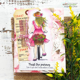 Vintage tag card on ledger paper and doily, the girl in a hot-pink dress with a basket of flowers, sentiment 'Trust the journey.'