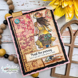 Mixed-media card on rust floral patterned paper with a black torn frame, the hatted girl and her flower bicycle stamped in cream tones, sentiment 'Trust the journey.'