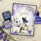 Card of two bunnies in a lavender oval with a butterfly and pansies, 'Welcome Spring.'