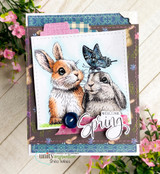 Card of two bunnies nose to nose with a blue butterfly, 'Welcome Spring.'