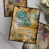 Layered antique-toned cards with teal and plum camellias over a stencilled dot background, sentiment 'Sending gentle strength and prayers your way.'