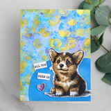 Handmade card featuring the Sophie the bright-eyed corgi puppy, on a blue and gold mixed-media background, stamped with 'You lift my heart like nobody else'.