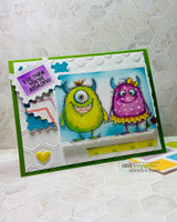 Green-framed card with two monsters, one purple and one green, on a scalloped panel.
