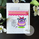 Soft white embossed card with a small pink monster and the 'Embrace your unique brilliance' sentiment.