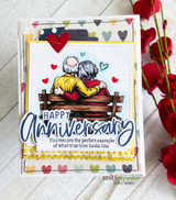 Card with an older couple seated close together and hearts, script 'Happy Anniversary - you two are the perfect example of what true love looks like.'