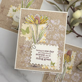 Card with a coneflower over floral papers and the 'one day at a time' encouragement sentiment.