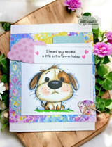 Bright card of the puppy on a rainbow floral panel with a soft border.
