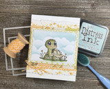 Card with the turtle and clouds beside distress ink, tan and cream tones.