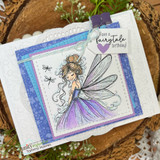 Rustic card of the fairy in a green dress over layered papers with "have a fairytale birthday!"
