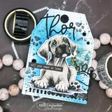 Bright teal mixed-media card with the puppy die-cut over splattered blue paint and the name 'Thor' lettered across the top.