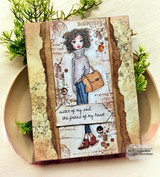 Vintage ephemera card with the girl in gray with a tan bag between torn edges and the sister of my soul sentiment