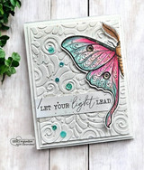 The luna moth in pink-to-teal ombre on a silver swirl-embossed card — 'Let your light lead.'