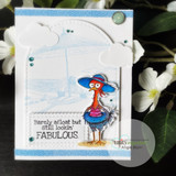 Card of a blue beach chicken in a floppy hat against a cloudy sky panel.