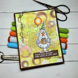 A quirky party-hatted chicken stamped in red rubber and colored on a handmade card reading "Your birthday suit needs ironing."