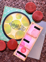 Card with a bold navy ring framing colorful stamped circles and the script 'oh hey, hi, hello!'