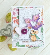Card with the mouse holding a purple and green leaf over embossed white and autumn-leaf papers with a heart button and the you're my favorite fall feeling sentiment.