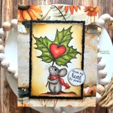 Vintage card with the mouse holding a deep green leaf with a red heart on a distressed panel in a black frame, with the from my heart to yours circle tag.