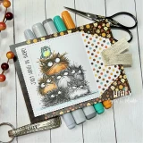 Handmade sample card using the Fall Tones papers — grumpy fuzzy birds with a hang-in-there greeting on autumn polka-dot and floral papers, styled with scissors and teal markers.