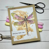 Kraft card with the dragonfly softly colored in pinks over a tea-stained panel, 'Healing takes time'