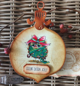 Ornament-shaped card with a green scruffy bird wrapped in ribbon, 'Feelin' extra jolly.'