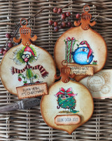 Three ornament tags with holiday birds, 'Flock yeah, it's Christmas!' and 'Feelin' extra jolly.'