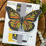 Card with a warm orange-and-yellow monarch butterfly and patterned strips and 'just because you're wonderful.'