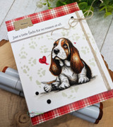 Plaid card of the basset hound with a red heart and 'Just a little love for no reason at all.'