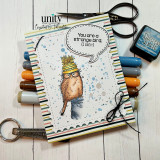 Journal-style card with a scruffy bird and a stamped bubble reading 'you are strange and I like it', ink pads alongside.