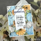 Card bordered with outlined pumpkins in soft blue, cream and orange around a tag reading 'You're the pumpkin to my spice. Life's just sweeter with you around,' tied with grey twine.