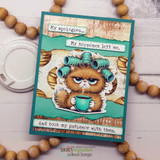 Grumpy cat in hair curlers holding a teacup on a teal-and-cork card with 'My apologies... My hormones left me, And took my patience with them.'