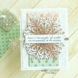 Card of the intricate white snowflake layered on a soft pink panel, 'Here's to the wonder of winter and the warmth of the holidays'.