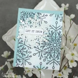Frosted Lace card from Unity Stamp Co: a large navy lace snowflake stamped over a pale aqua blended panel, with white glittered snowflakes and a 'LET IT SNOW' label.