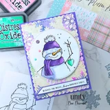 Card made with Sugarplum Frost papers, a snowman in a purple hat and scarf inside a scalloped circle on a lavender base, with an ink pad alongside.