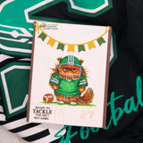 Card of the football cat in a green jersey number 27 on a team-shirt background, 'ready to tackle the day? no? same.'