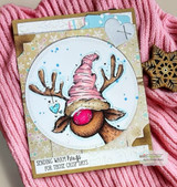 Card with the reindeer in a pink cap on a circle over a knit sweater and the warm-hugs sentiment.