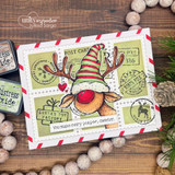 Postcard-style card with the reindeer in a striped cap over postal papers and 'You make every season sweeter.'