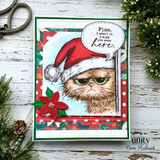 Card of the grumpy cat in a red Santa hat with poinsettias, 'fine. I admit it. I wish you were here.'