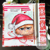 Card of the red-hatted grumpy Christmas cat on holiday papers with red twine, 'silent night? yes please.'