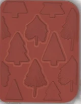 Ornamental Pines red rubber stamp sheet: an A2 background of sketchy pine trees in rows, with pop-out single tree stamps.