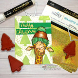 Lime and green Christmas card with stamped pine trees and a giraffe in a knit pom-pom hat peeking up, with a gold foiled Merry Christmas banner.