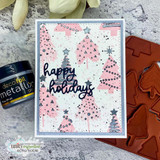 Pink and navy card with a blush stamped pine background, black stencil dots and stars, and a navy Happy Holidays die-cut.