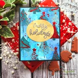 Blue and teal inked Christmas card with red and gold stamped pines, red splatter and a gold oval holding a silver Merry Holidays die-cut.