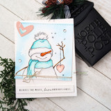Snowman in a teal scarf on a soft blue card with pink hearts.