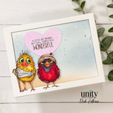 Soft card of two bandaged birds — one yellow, one red — under a pink heart, 'a little bit broken but still completely wonderful.'