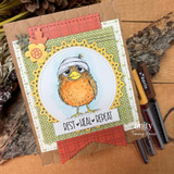 Circle-framed card of a fluffy orange bandaged bird with 'rest heal repeat' on green and rust papers.